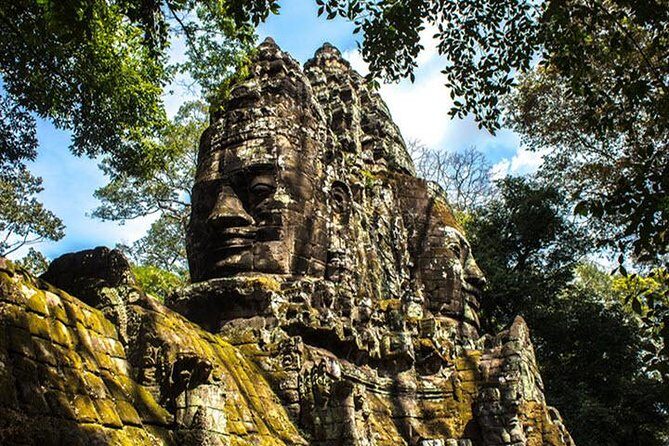 Angkor Wat highlight Tour From Sunrise -Small Group - Angkor Thom South Gate: the first big statement of the complex