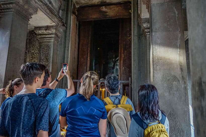 From Siem Reap: Angkor Wat Full-Day Private Tour & Sunrise - Angkor Thom’s Ancient Gate and Bayon: stone faces and big meanings