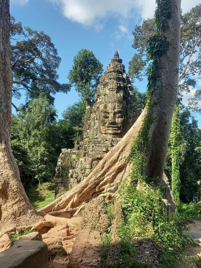 Shared day tour with Spanish-speaking guide at Angkor Temple. - Bayon temple faces: the best place to learn how Angkor “talks”
