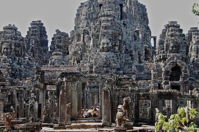 Three-day tour Discovering Siem Reap highlight ,Beng Mealea and Floating Village - Day 1: Angkor Wat Sunrise, Angkor Thom Faces, and Ta Prohm Roots